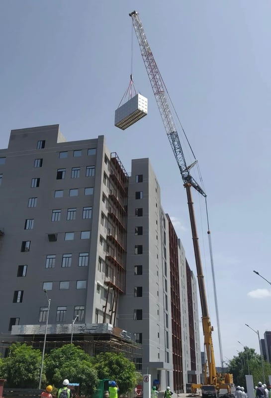 Moving the stainless steel water storage tank for high rise building.