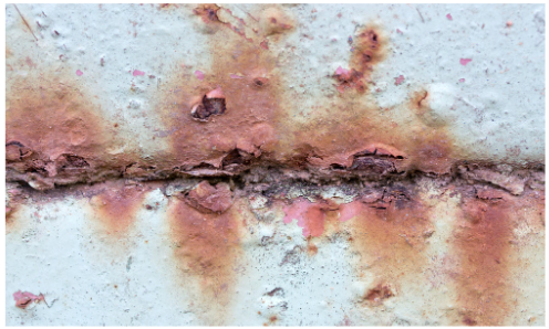 An image showing Crevice Corrosion in a water tank